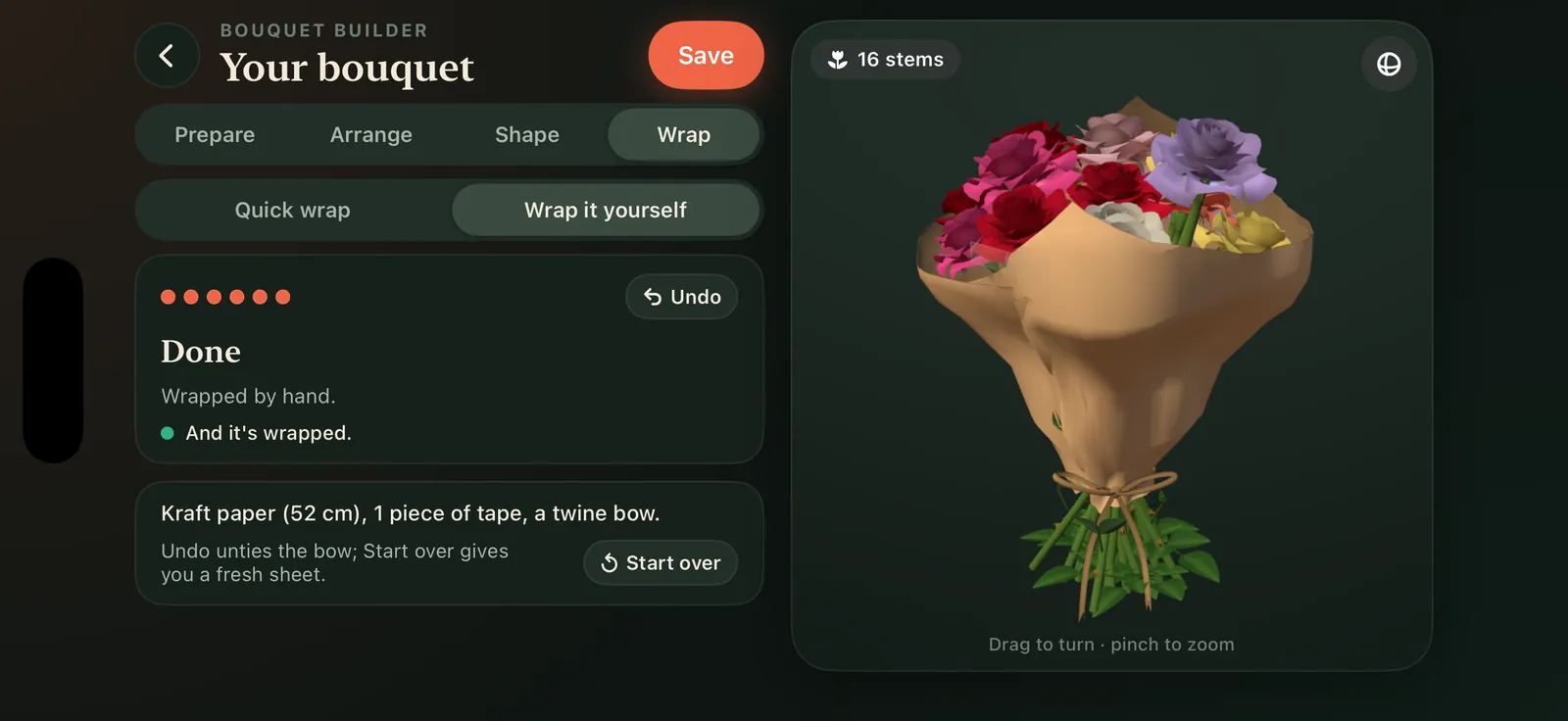 A bouquet wrapped by hand in kraft paper with a twine bow