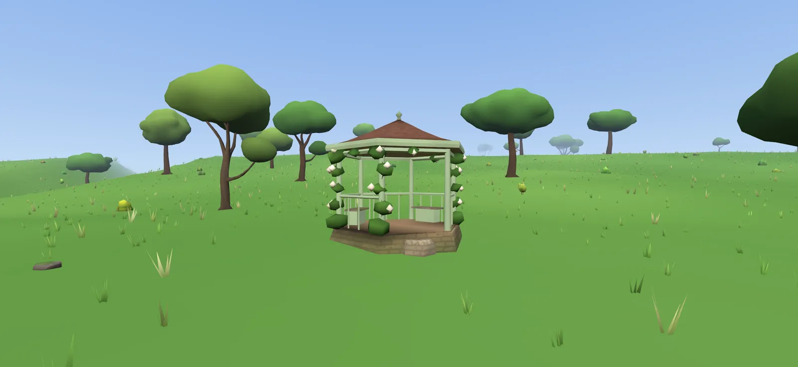 A white gazebo covered in climbing roses in a meadow